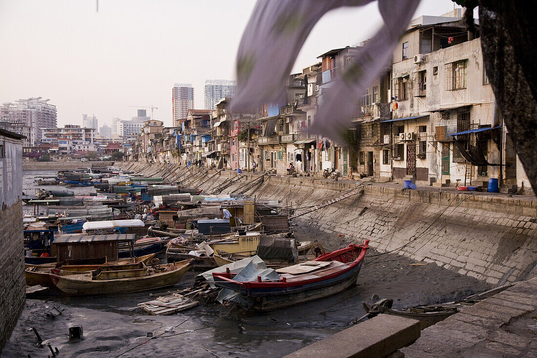 Old harbour with fishing boats at low tide, Siming district, Xiamen, Fujian province, China, Asia