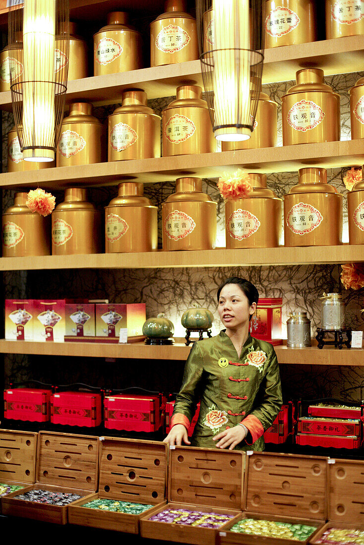Young saleswoman at a tea shop, Xiamen, Fujian province, China, Asia