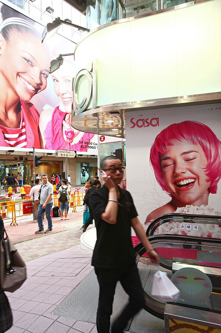 Chinese man telephoning at shopping center Central Plaza, Wanchai, Hong Kong, China, Asia