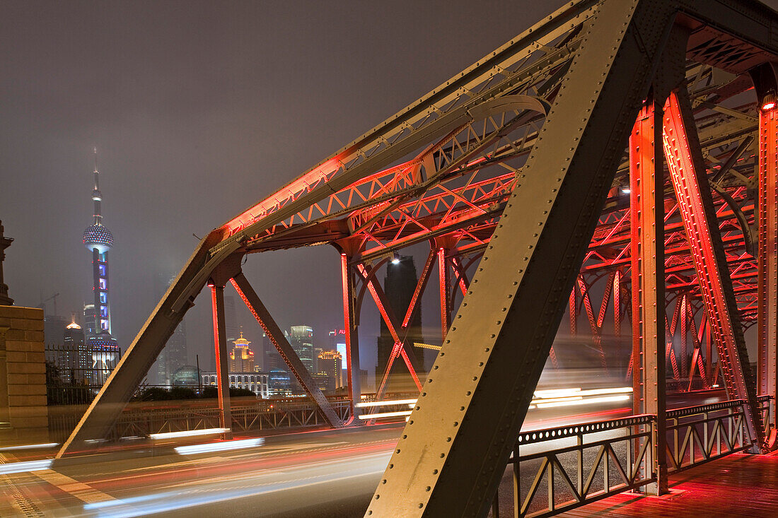 The illuminated Waibaidu bridge above the Souzhou canal at night, Bund, Shanghai, China, Asia