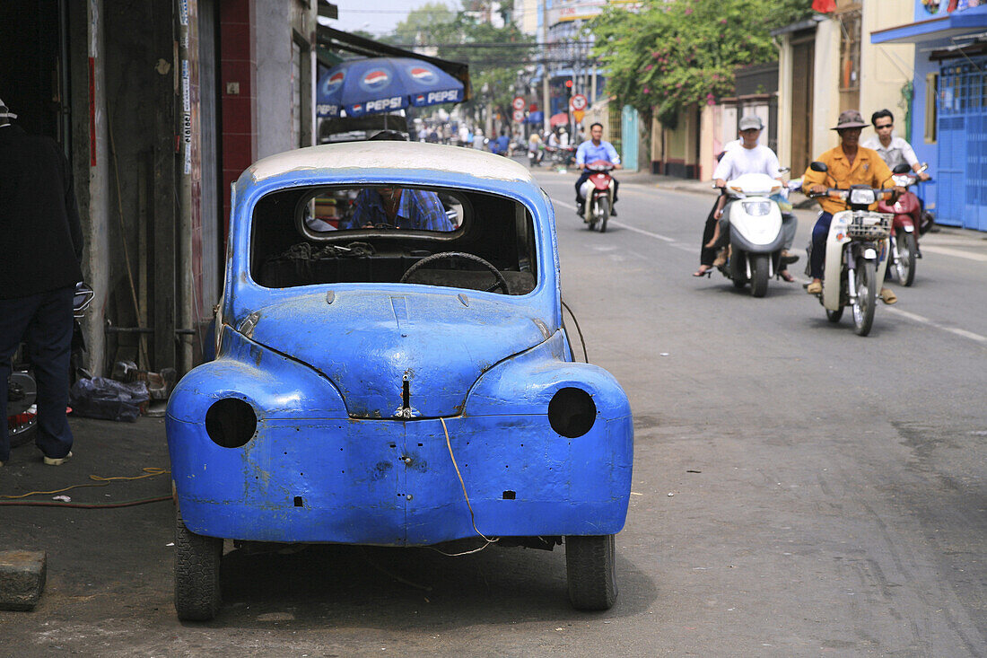 Blue car body in front of a car repair shop, suburb Cholon, Ho Chi Minh City, Saigon, Vietnam, Asia