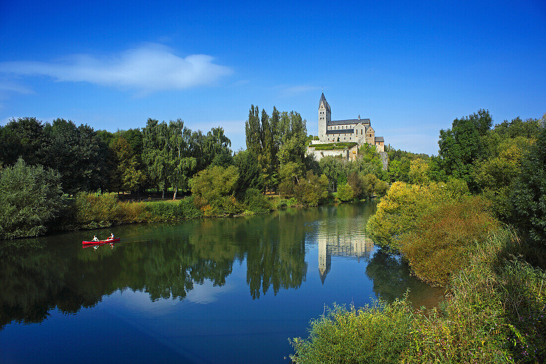 View over Lahn river to Lubentius Church, Dietkirchen, Hesse, Germany