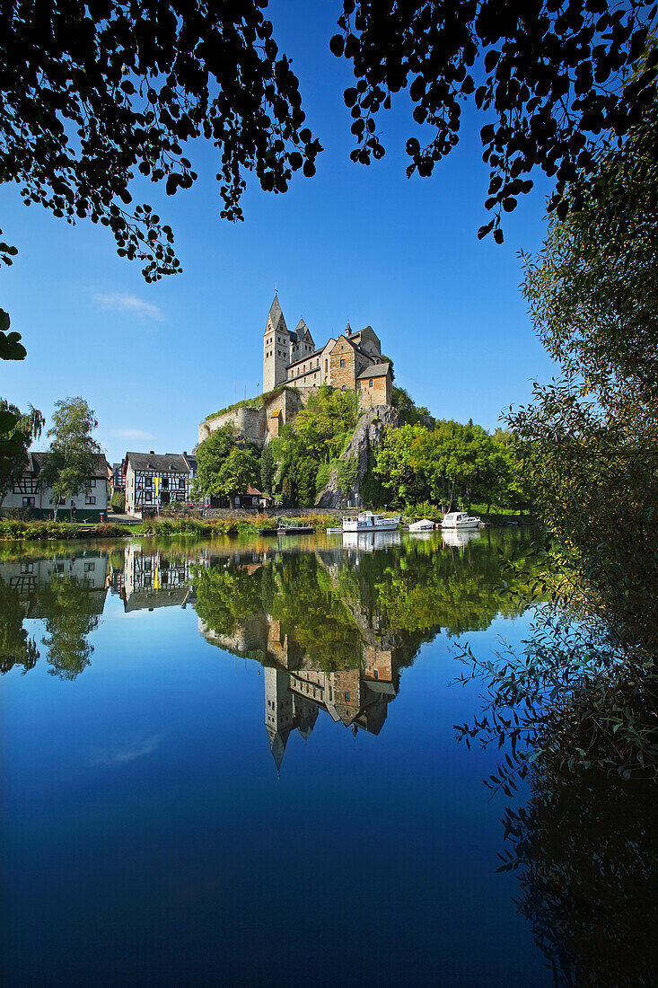 View over Lahn river to Lubentius Church, Dietkirchen, Hesse, Germany