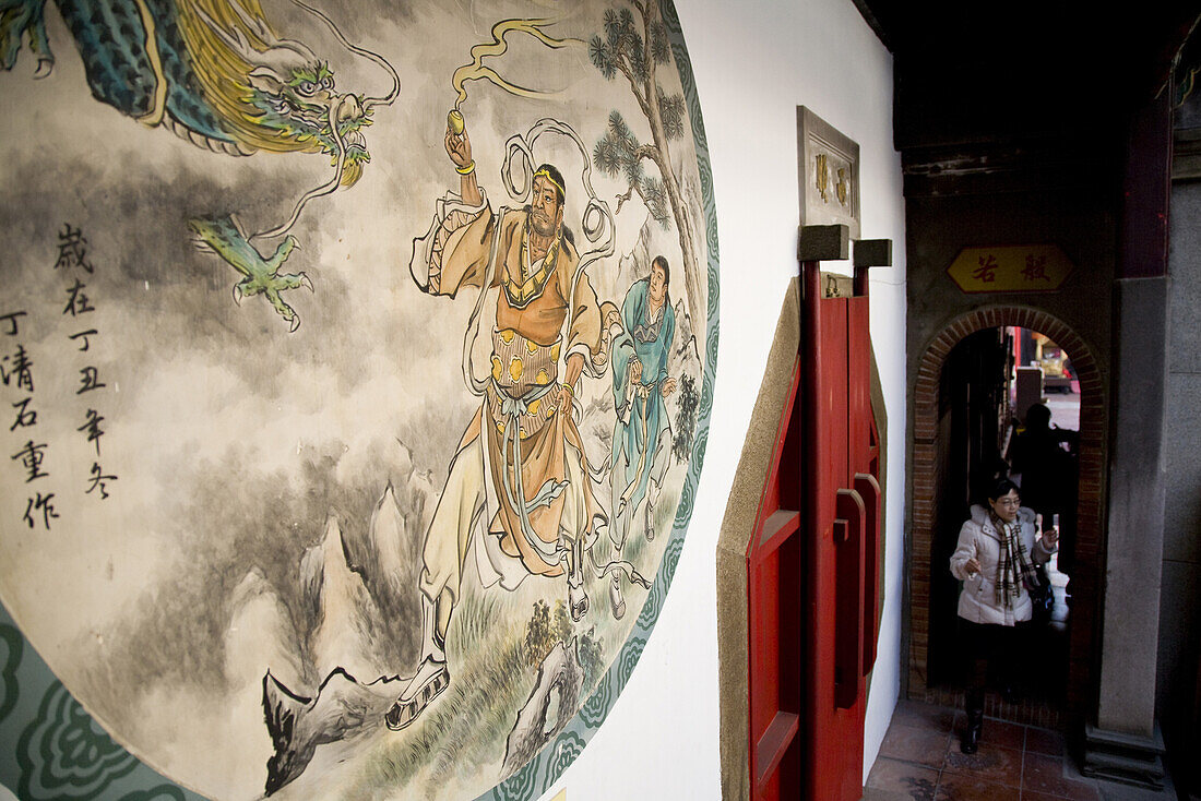 Mural and people at Matsu temple, Tainan, Republic of China, Taiwan, Asia