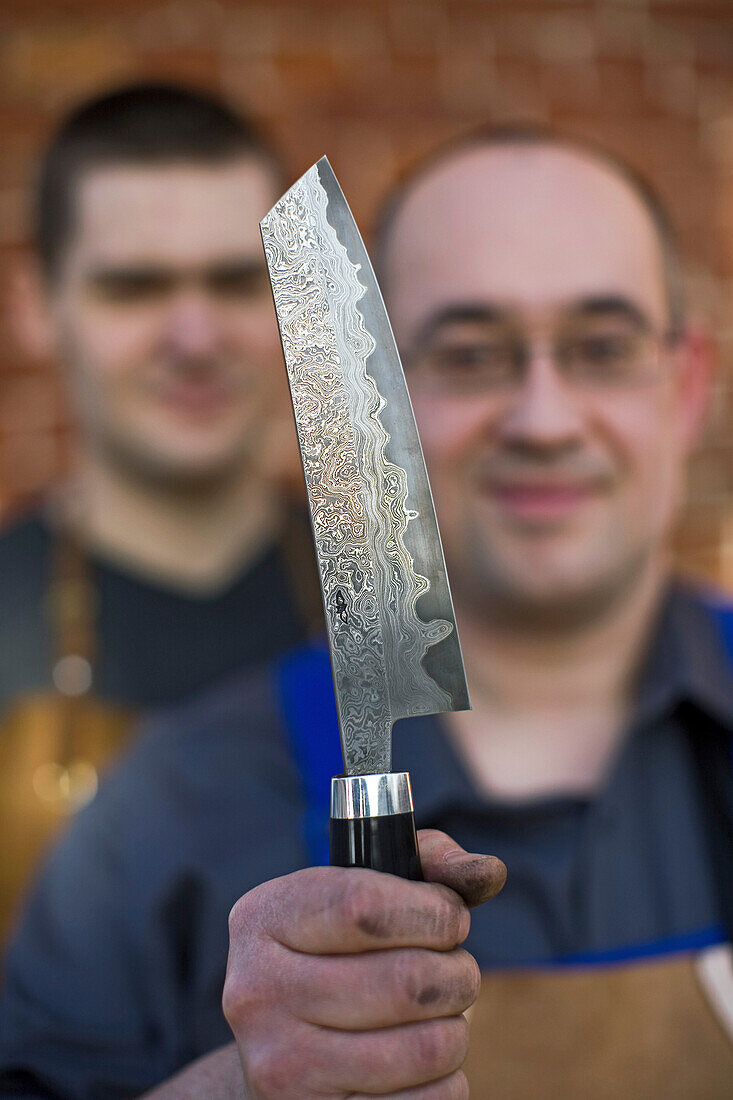 Lars Scheidler, bladesmith, with a Nesmuk knife, handcrafted most expensive knives, Wunstorf, region Hanover, Lower Saxony, northern Germany