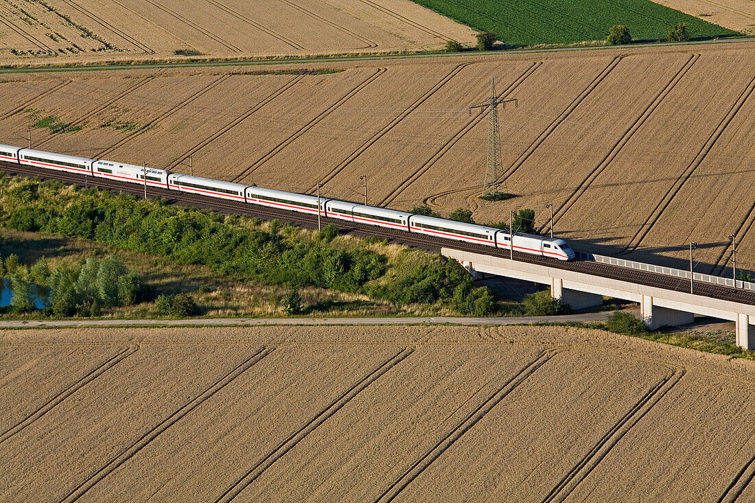 aerial photo of an  Inter-city train in the lanscape, Lower Saxony, Germany