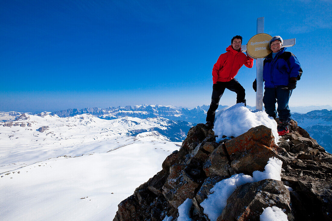Couple on summit of mountain Spitzmeilen, Canton of St. Gallen, Switzerland
