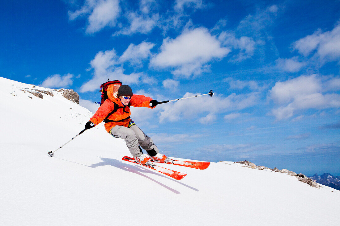 Woman downhill skiing, Wildhorn, Bernese Alps, Canton of Valais, Switzerland