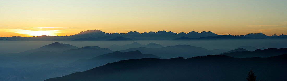 Sunset above Monte Rosa and Valais Alps, Ticino Alps in foreground, Monte Bisbino, Lake Como, Lombardy, Italy