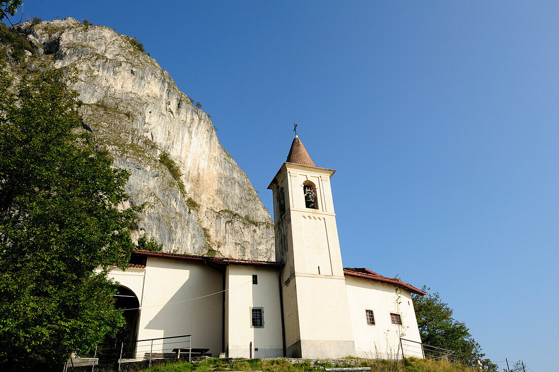 Church San Martino in front of rock face, San Martino, Lake Como, Lombardy, Italy