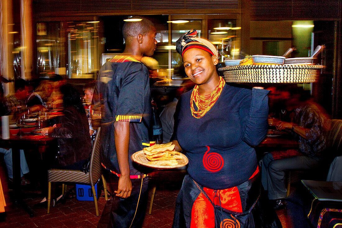African waitress in an African restaurant, Cape Town, Western Cape, South Africa, Africa