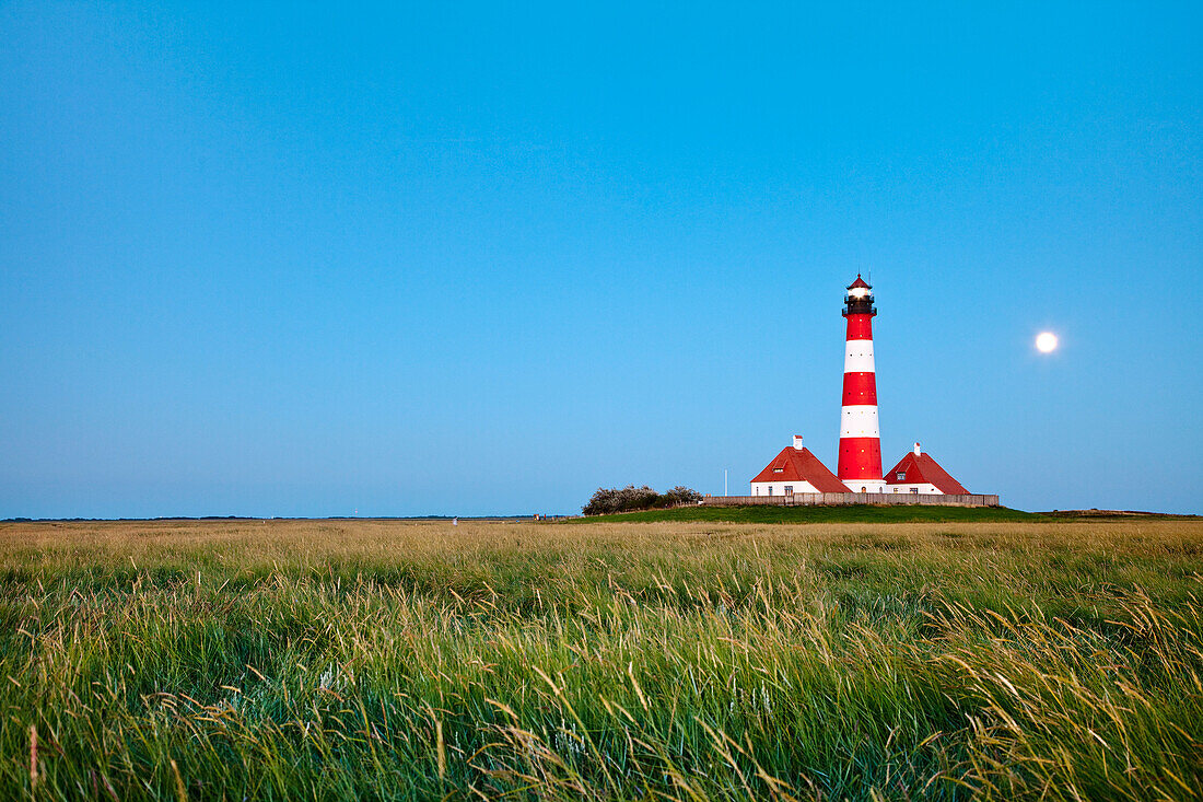 Westerheversand Lighthouse with full moon, Westerhever, Schleswig-Holstein, Germany