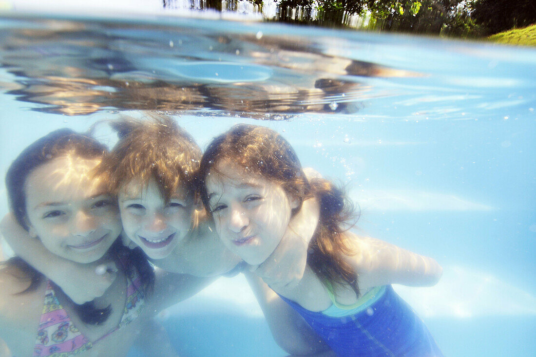 Kids having fun in the family pool,  Guararema,  Sao Paulo,  Brazil