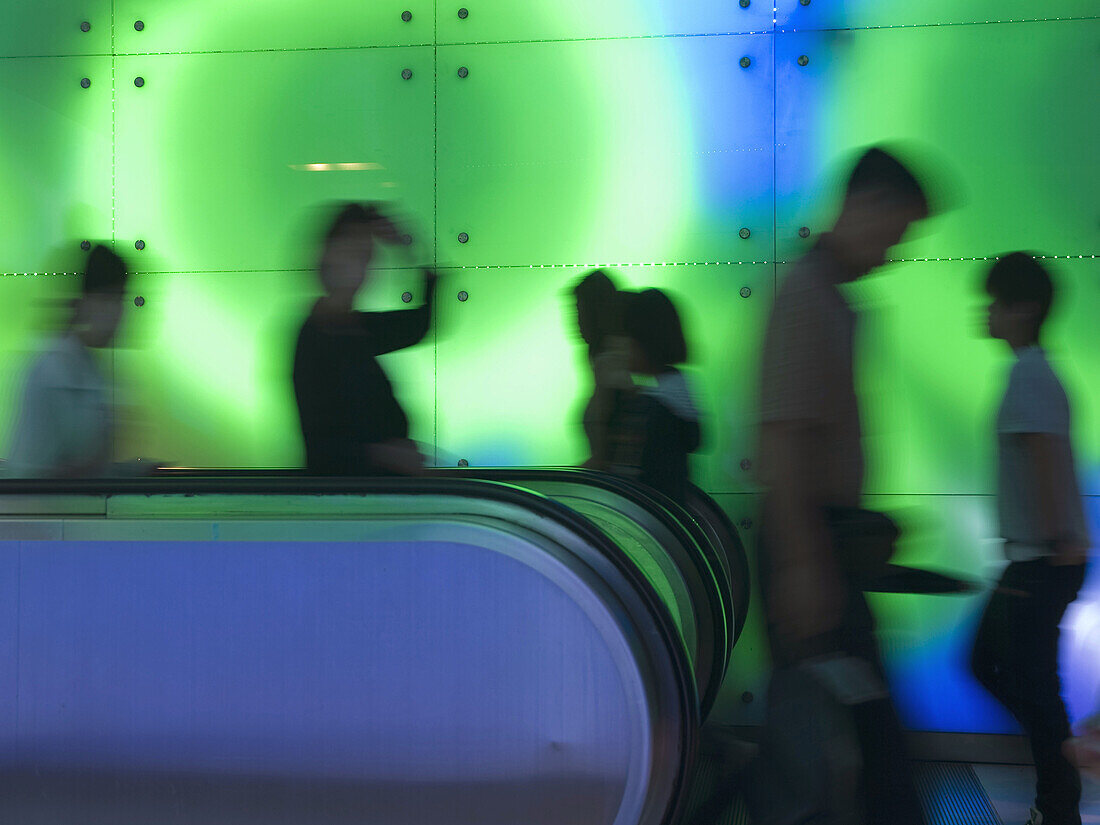 Travellers and shoppers in the underground stations of the city_state of Singapore