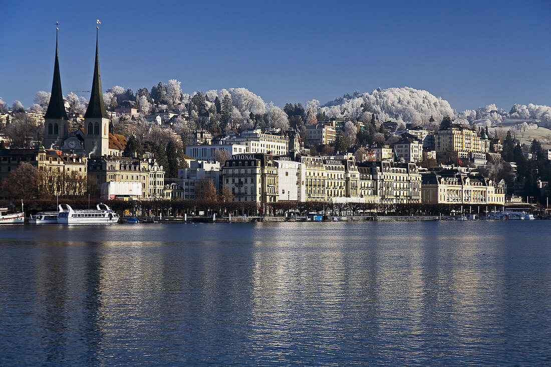 General view of the town of Lucerne Luzern in the Canton of Lucerne,  Switzerland with the Reuss River in the foreground and the Hofkirche church in the background