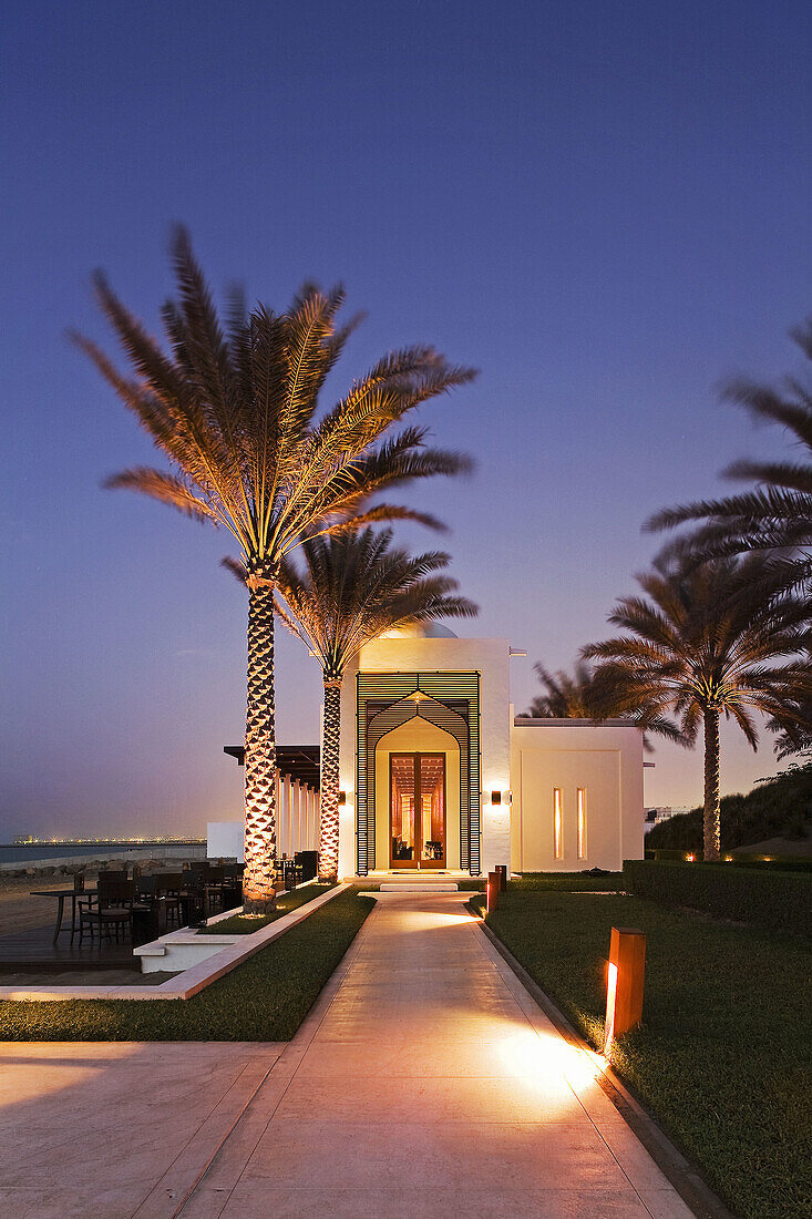 The seafood beach front restaurant of the luxury 5 star Chedi Hotel resort in Ghubrah,  Muscat,  Oman at sunset