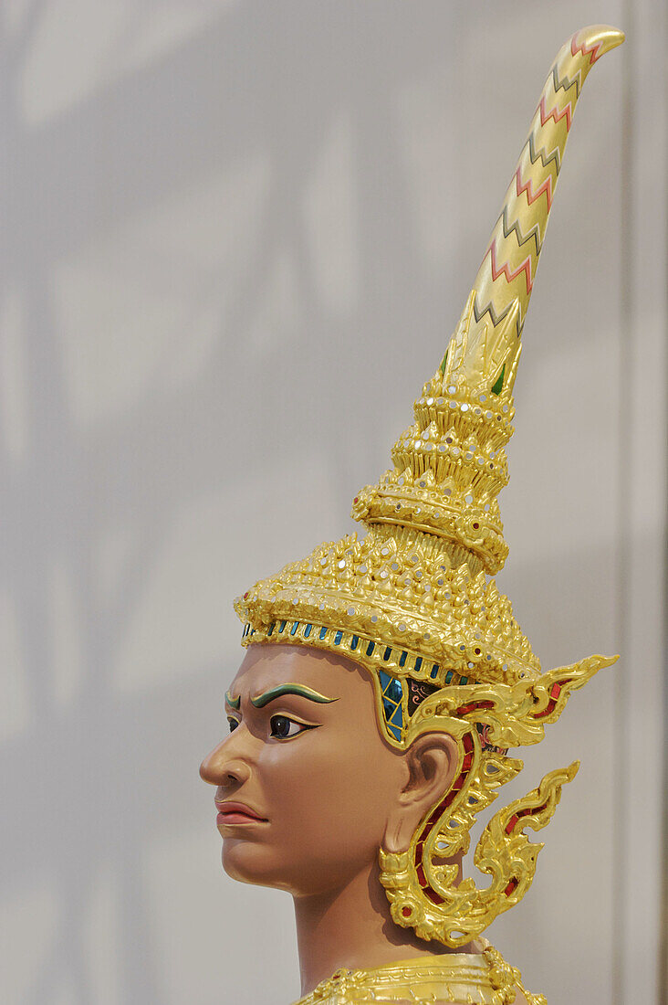 A carved head of a Thai man with a gilded crown,  as part of a display at the new Suvanabhumi airport