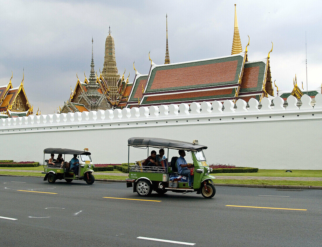 tuk tuks in front of the Grand Palace and Wat Phra Kaew in Bangkok Thailand