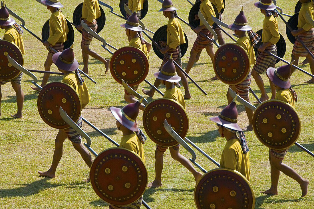 warriors marching to battle at the Surin Elephant Festival in Thailand