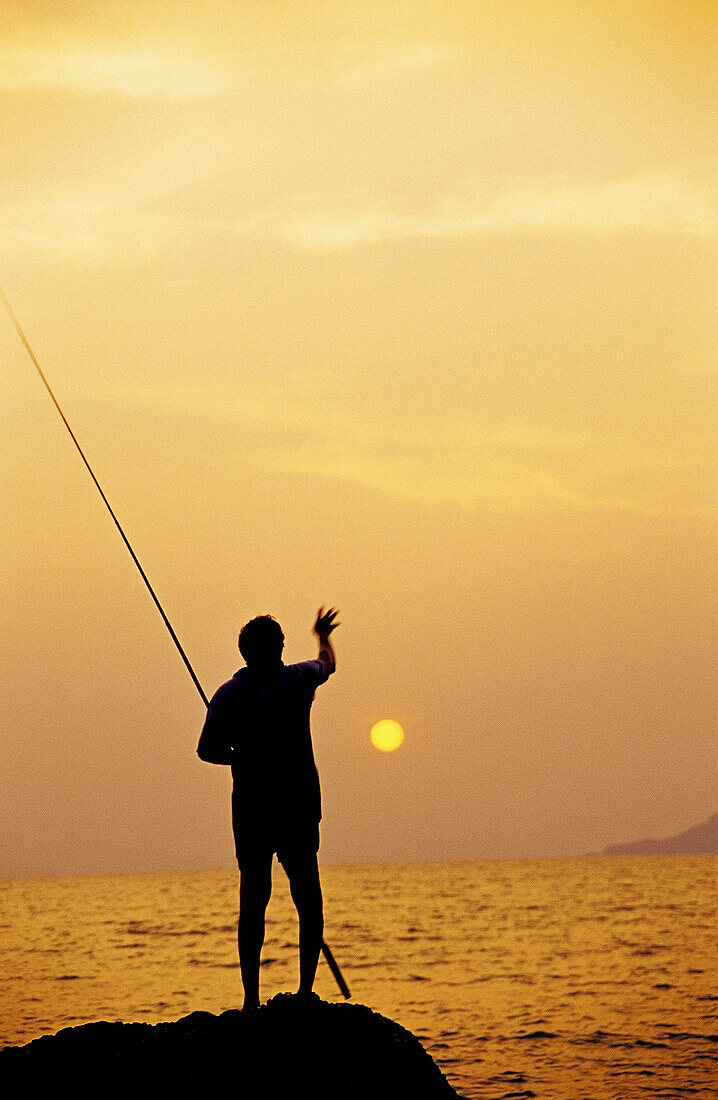 Silhouette of a Fisherman Hermal beach Goa,  India
