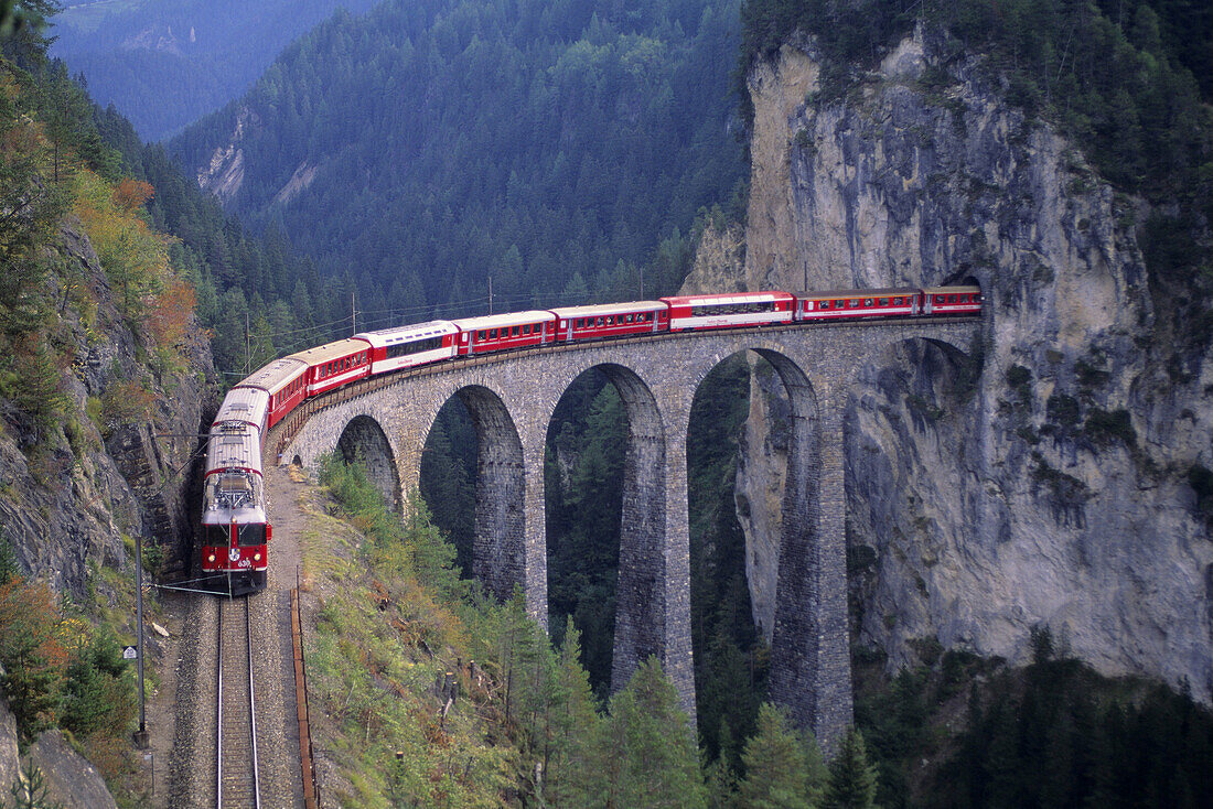 passenger train on the tallest rock bridge in Switzerland