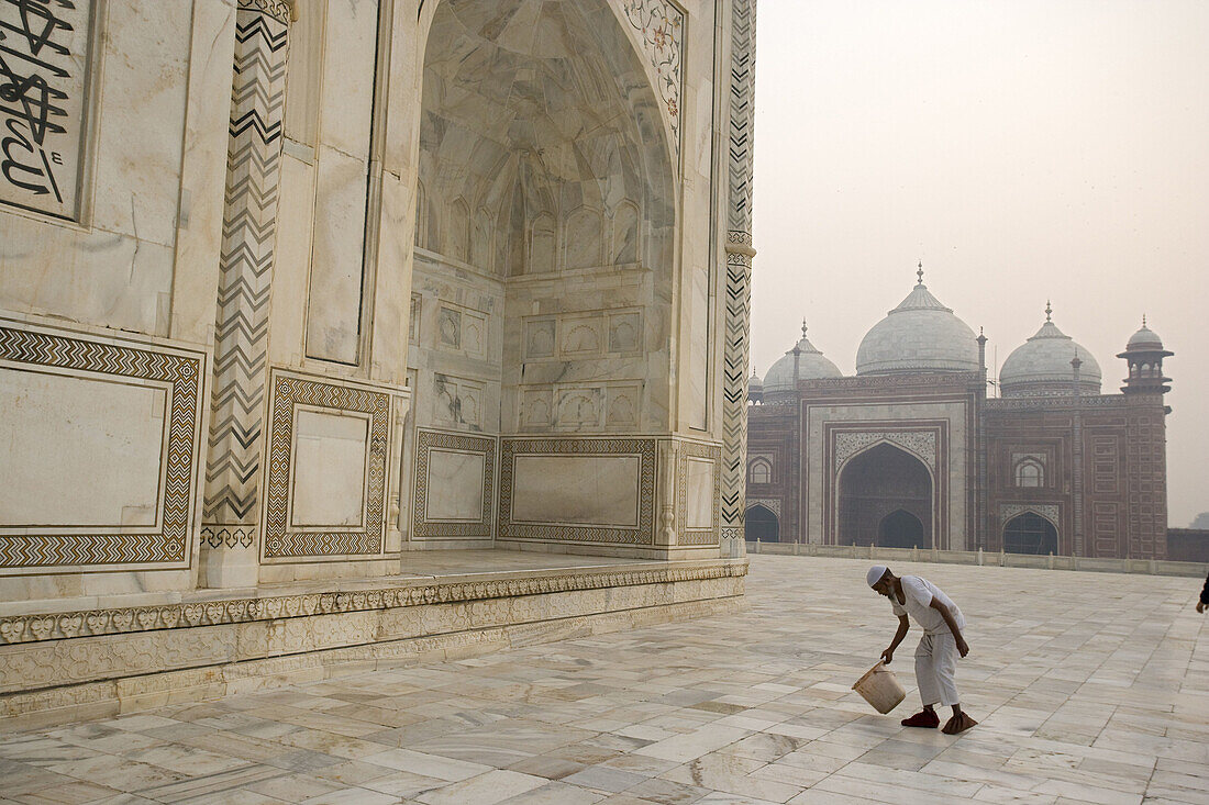 Man cleaning arownd Taj Mahal,  Built by Shah Jahan in memory of Mumtaz Mahal his wife