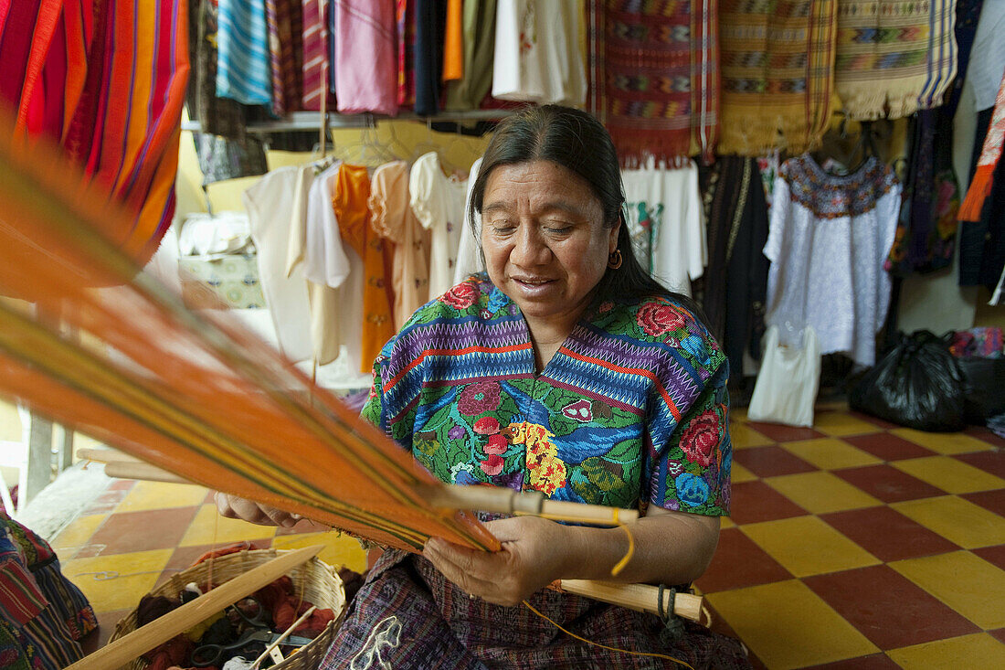 Guatemala,  Antigua,  Mayan woman weaving (MR)