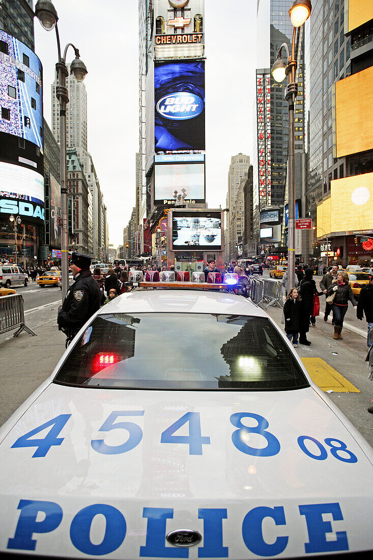 A police car of the New York City Police Department NYPD staying guard at Times Square which is located at the intersection of Seventh Avenue and Broadway,  Midtown West,  Manhattan,  New York City,  North America