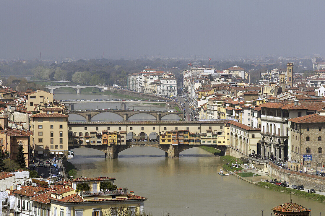 Aerial view of the old town of Florence with the Arno river and the Ponte Vecchio (Vecchio Bridge) at a sunny day with blue sky,  Florence (Firence),  Tuscany,  Italy,  Southern Europe
