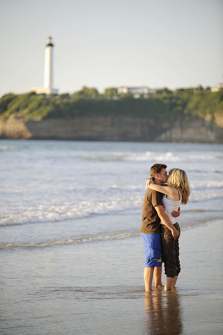 Couple kissing on beach,  Biarritz. Pyrénées-Atlantiques,  Aquitaine,  France