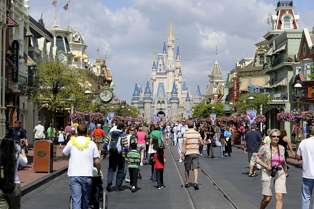 Main Street with crowd at Walt Disney Magic Kingdom Theme Park Orlando Florida Central