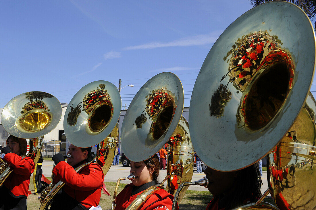 High School Band Members play tubas at Strawberry Festival Parade Plant City Florida
