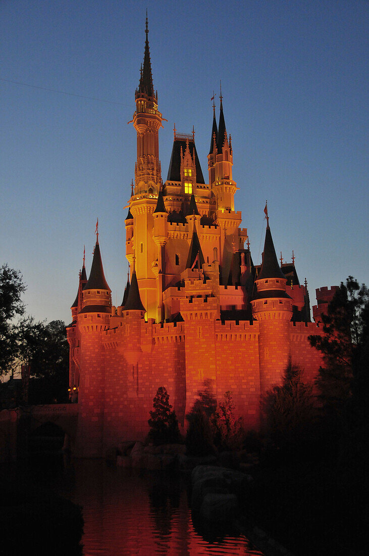 Evening illuminated view of Cinderella Castle at Walt Disney Magic Kingdom Theme Park Orlando Florida Central