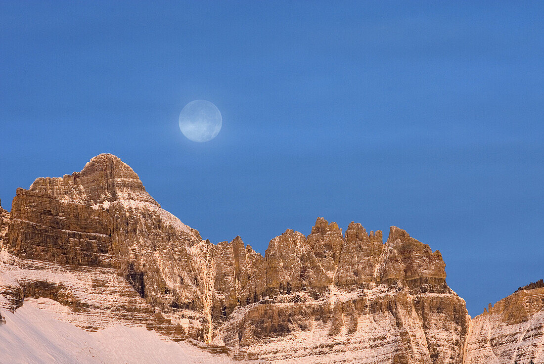 Moon over Mount Wilbur 9, 321 ft 2, 841 m at dawn,  Glacier National park Montana USA