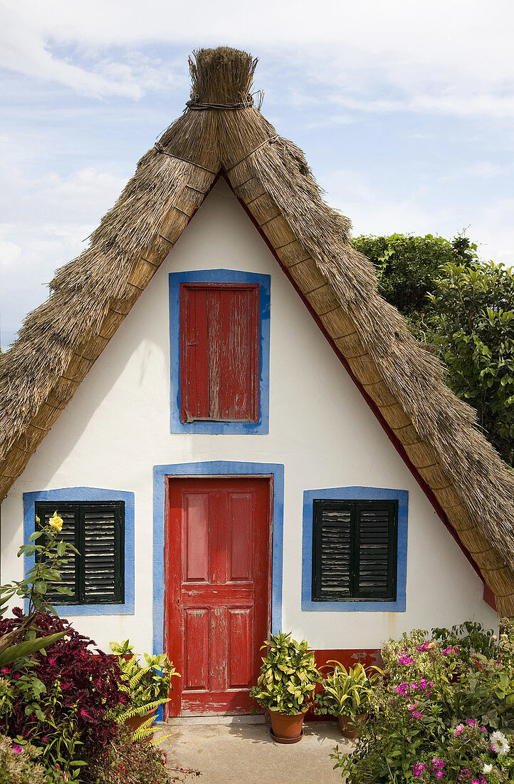 Portugal,  Madeira Islands Santana Palheiro: typical straw roof house