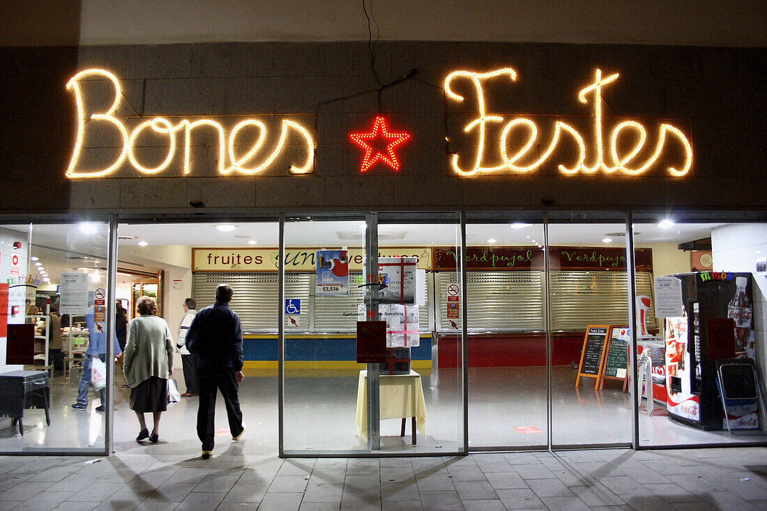 Merry Christmas sign at Fort Pienc market,  Barcelona. Catalonia,  Spain