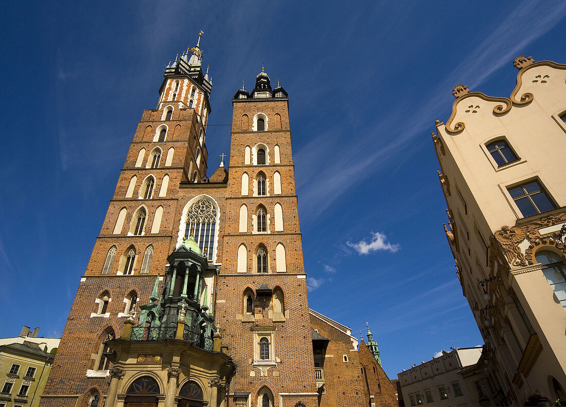 Poland Krakow St Mary´s Church with the Art Nouveau Czynciel´s House at Main Market Square