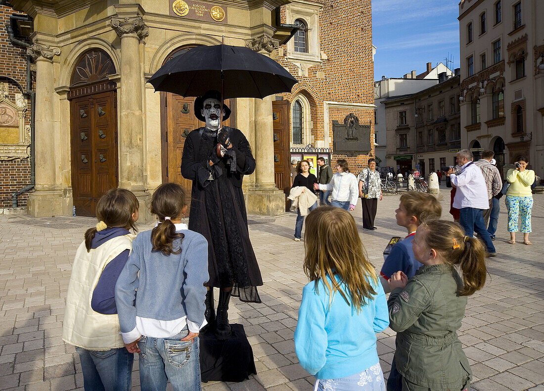 Street performer at Main Market Square,  Krakow,  Poland