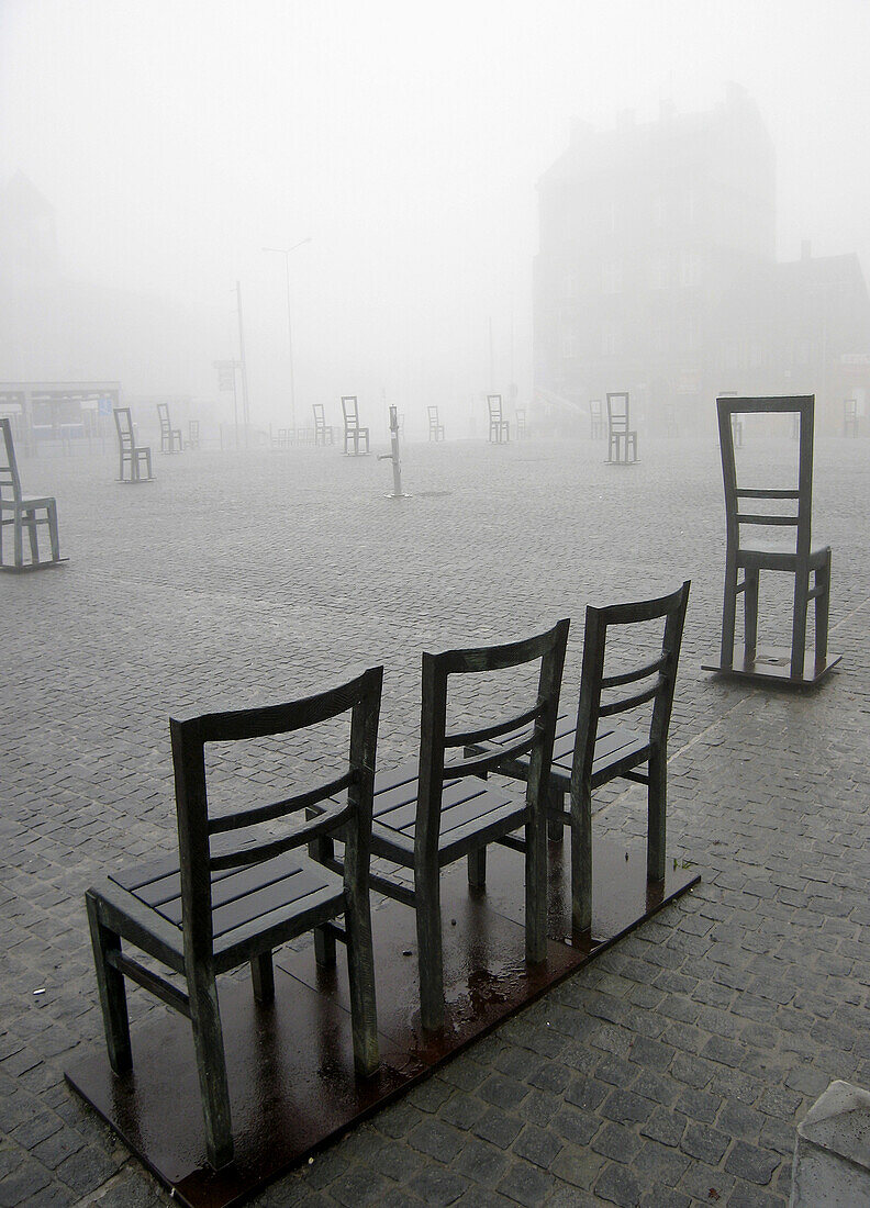 Poland,  Krakow,  Podgorze district,  Memorial to the heroes of the Krakow ghetto,  metal chairs