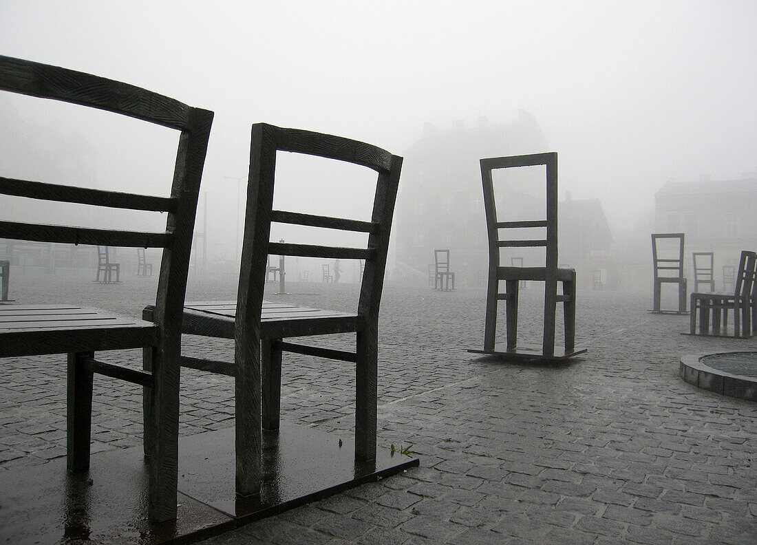 Poland,  Krakow,  Podgorze district,  Memorial to the heroes of the Krakow ghetto,  metal chairs