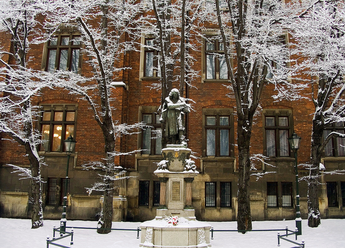 Poland,  Krakow,  Monument to astronomer Nicolaus Copernicus at winter