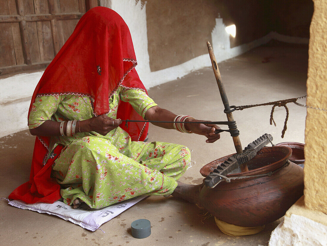 India,  Rajasthan,  Jaisalmer,  woman working in a kitchen