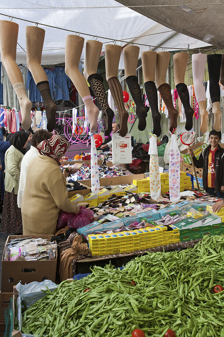 weekly market in Tarbalasi, stalls with  green beans and stockings and socks, Istanbul, Turkey
