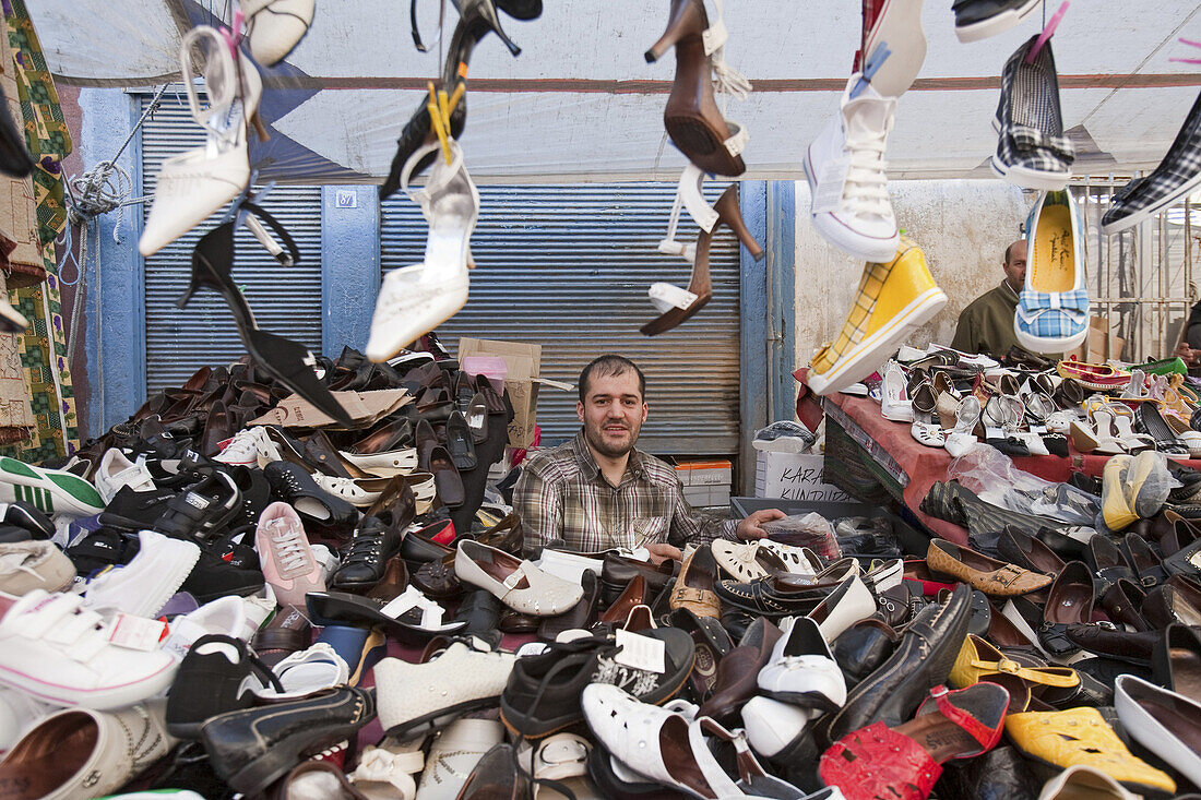 shoe seller, stall at the Tarlabasi markets below the Beyoglu district, Istanbul, Turkey