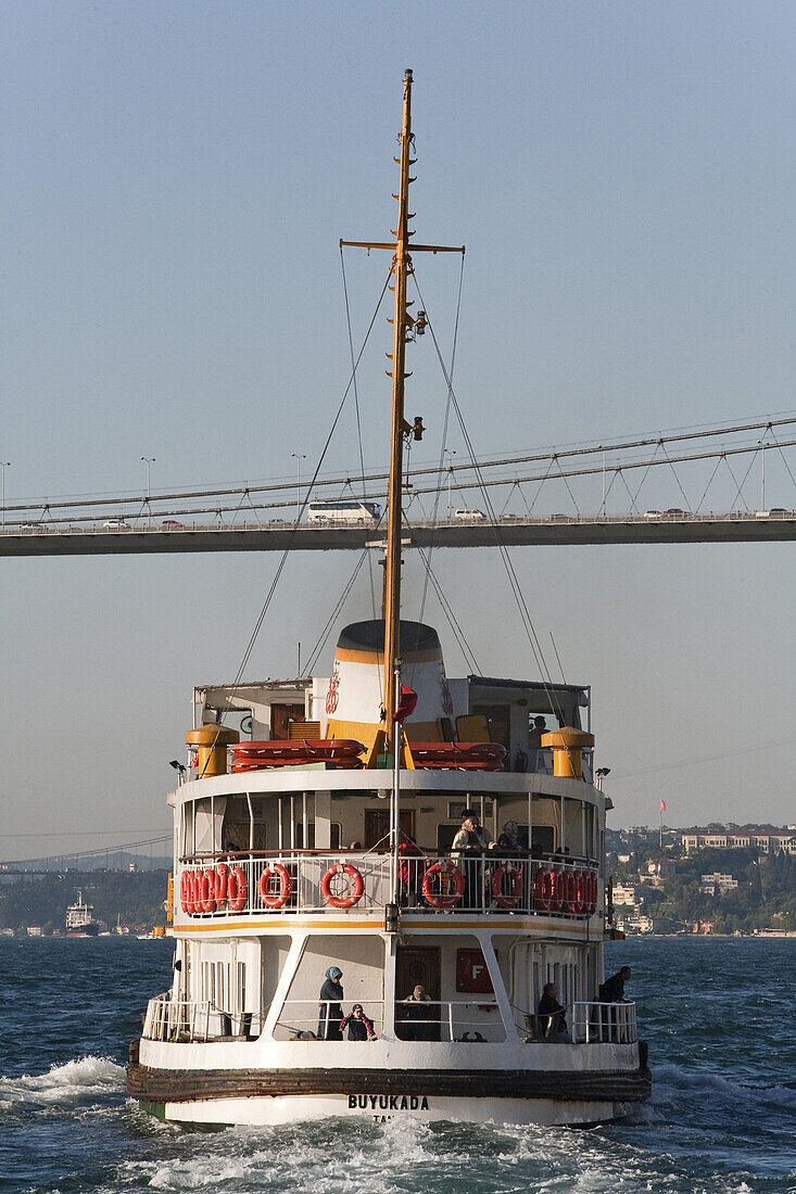 commuter ferry under the Bospohorus Bridge, rear view, Istanbul, Turkey