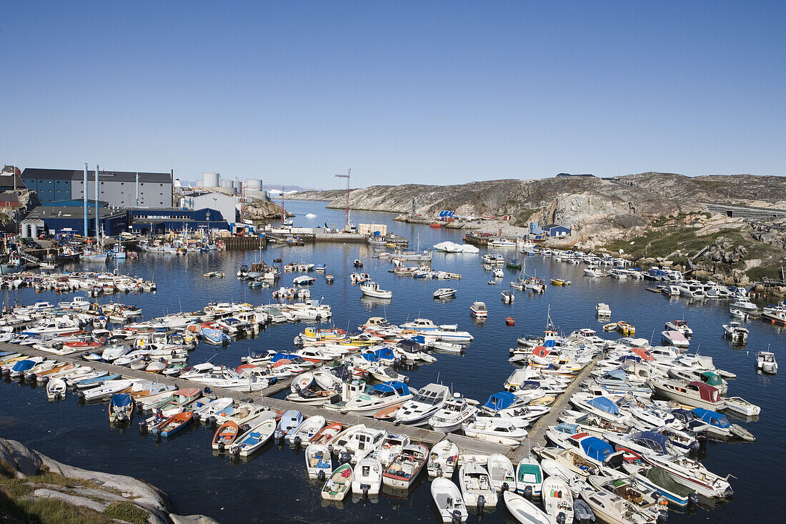 Fishing boats at harbour and Royal Greenland Seafood Processing Plant, Ilulissat (Jakobshavn), Disko Bay, Kitaa, Greenland