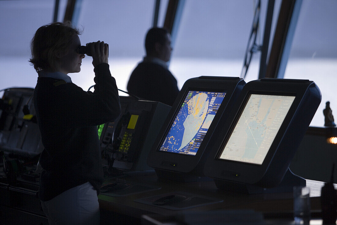 Officers on bridge of cruise ship MS Deutschland, Prince Christian Sound, Kitaa, Greenland