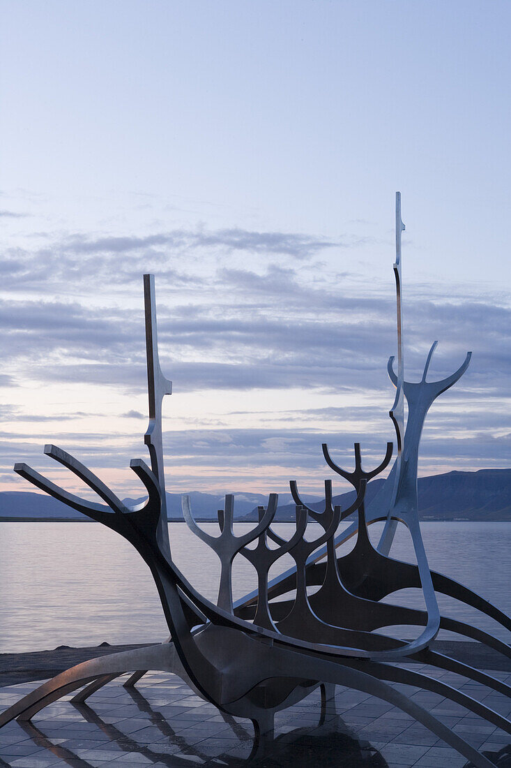 Sculpture of a viking ship on the waterfront in the evening, Reykjavik, Iceland, Europe