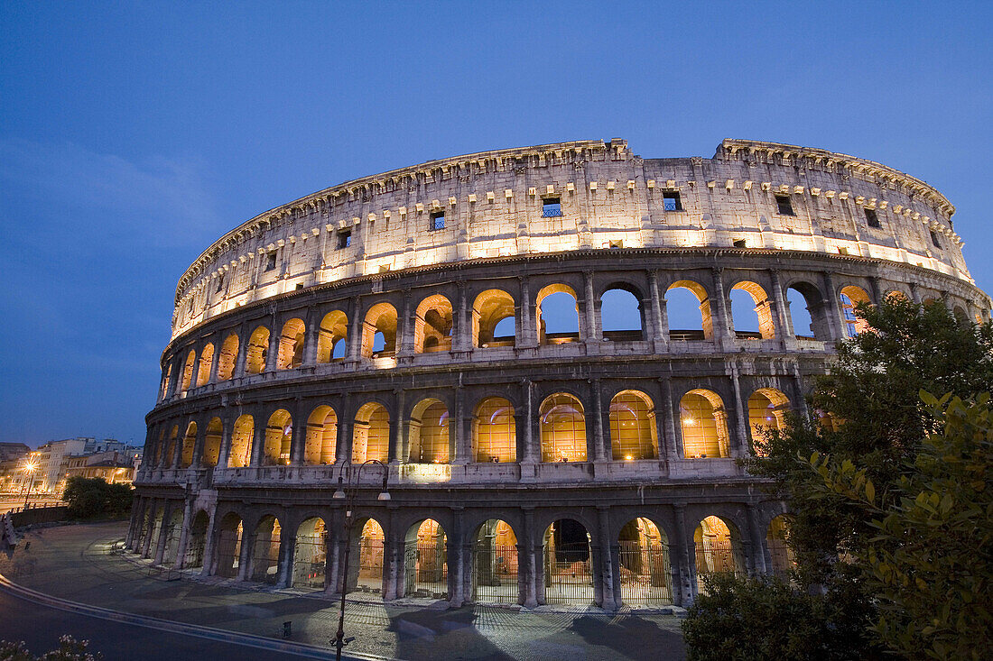 Italy,  Rome,  illuminated coliseum at dusk