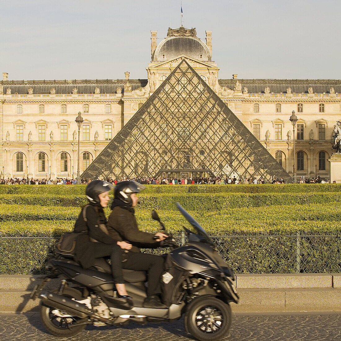 In the background The new entrance to the Musee du Louvre,  a pyramidal,  glass structure designed by renowned American architect I M Pei  Paris,  France